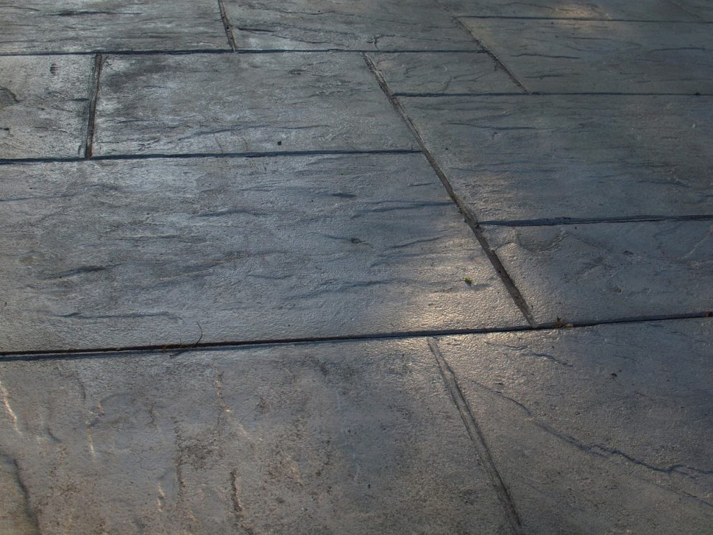 Stamped concrete patio with a stone-like texture.